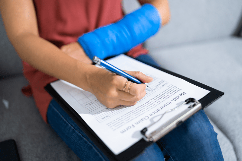 workers compensation, filling out form with pen